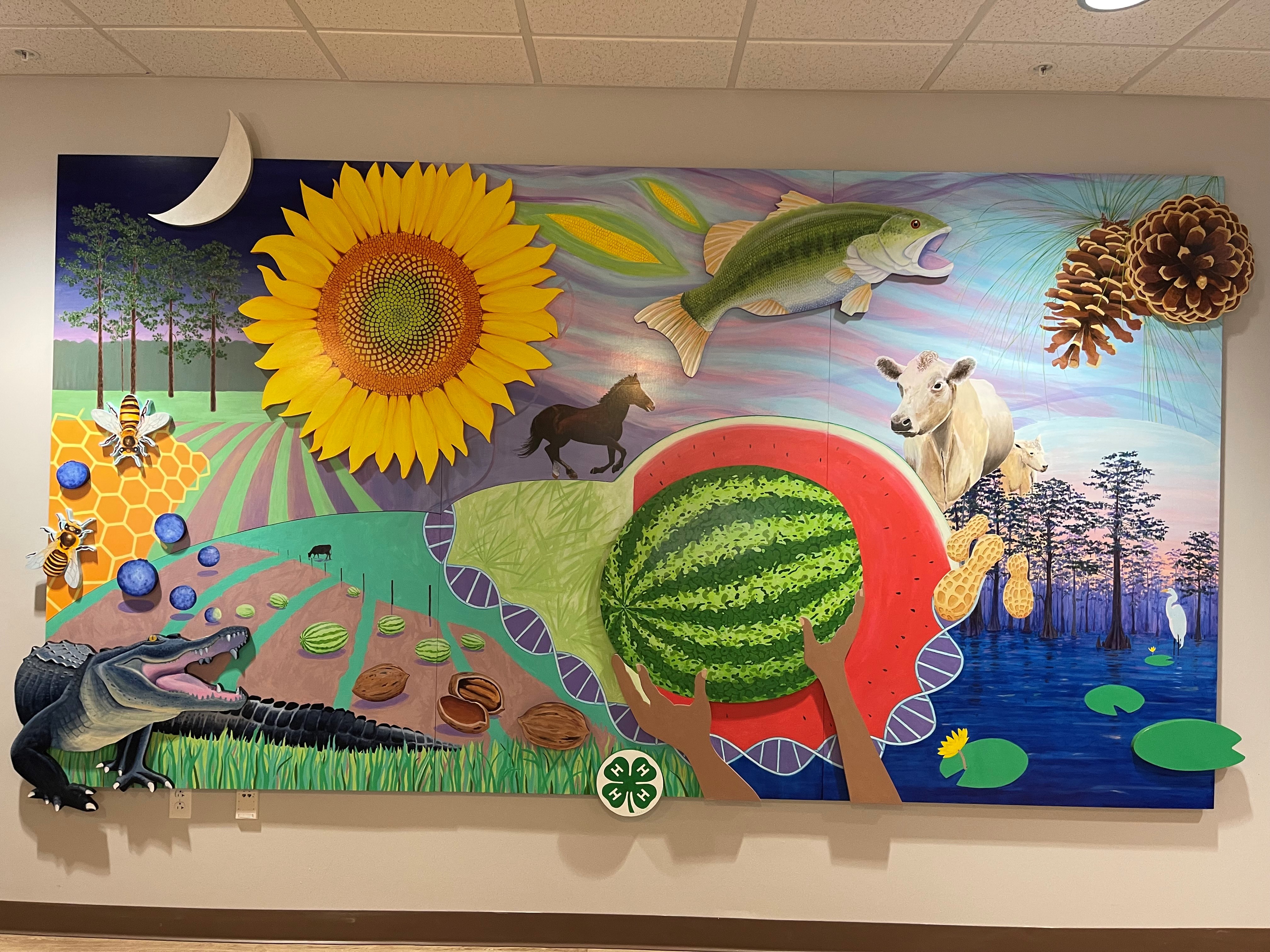 3D Mural depicting farms, alligators, fish, watermelons, and sunflowers