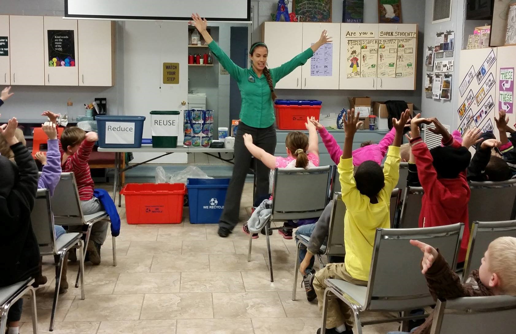 Alachua County employee giving a recycling presenttion to local schoolchildren